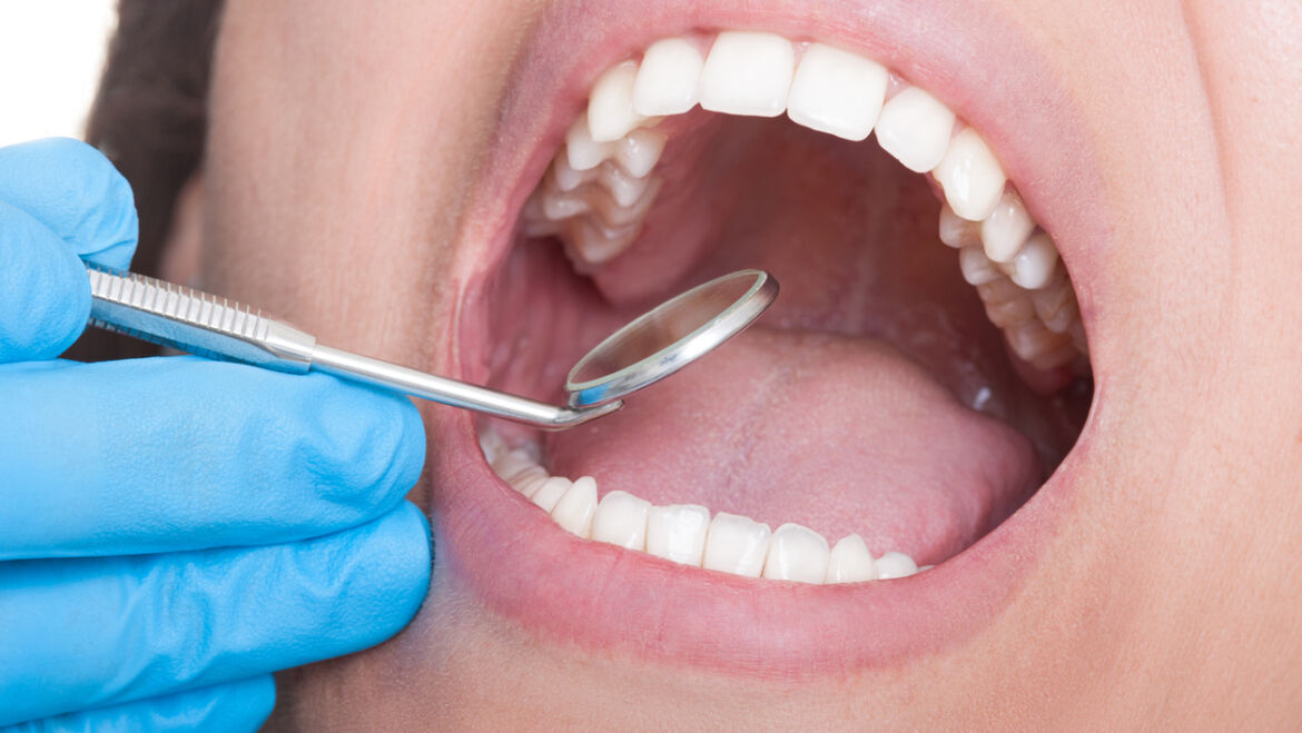 How does a dentist perform dental restoration?